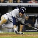 Tampa Bay Rays' Matt Joyce falls after twisting his left ankle while watching his ninth-inning, three-run home run against the New York Yankees in their baseball game at Yankee Stadium in New York, Wednesday, May 9, 2012. The Rays won 4-1. (AP Photo/Kathy Willens)
