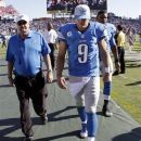 Detroit Lions quarterback Matthew Stafford (9) leaves the field after losing to the Tennessee Titans 44-41 in overtime at an NFL football game on Sunday, Sept. 23, 2012, in Nashville, Tenn. (AP Photo/Wade Payne)