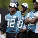 Jacksonville Jaguars running back Maurice Jones-Drew (32) watches practice from the sidelines during a voluntary veteran NFL football mini-camp,  Tuesday, April 16, 2013, in Jacksonville, Fla. Jones-Drew is recovering from a foot injury he suffered last season. (AP Photo/Stephen Morton)
