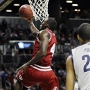 Indiana guard Victor Oladipo (4) goes up for a layup past Georgetown's Otto Porter (22) during the first half of their championship NCAA college basketball game at the Legends Classic at Barclays Center, Tuesday, Nov. 20, 2012, in New York. (AP Photo/Kathy Willens)