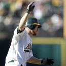 A’s rally to beat Mariners 7-4 in 10 innings (Yahoo! Sports)