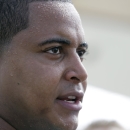 FILE - In this July 22, 2013, file photo, Miami Dolphins tackle Jonathan Martin in interviewed after an NFL football practice in Davie, Fla. In the stadium program sold at the Miami Dolphins' game on Halloween, Richie Incognito was asked who's the easiest teammate to scare. His answer: Jonathan Martin. The troubled, troubling relationship between the two offensive linemen took an ominous turn Monday, Nov. 4, 2013, with fresh revelations: Incognito sent text messages to his teammate that were racist and threatening, two people familiar with the situation said.(AP Photo/Lynne Sladky, File)