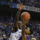 Kentucky's Julius Randle, left, goes up in an attempt to block the shot of Montevallo's Troran Brown during the first half of an exhibition NCAA basketball game, Friday, Nov. 4, 2013, in Lexington, Ky. (AP Photo/Timothy D. Easley)