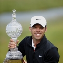 England's Paul Casey holds the Irish Open trophy after winning the tournament at Carton House, Maynooth, Ireland, Sunday, June 30, 2013. (AP Photo/Peter Morrison)