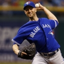 Toronto Blue Jays starting pitcher J.A. Happ throws during the first inning of a baseball game against the Tampa Bay Rays Tuesday, May 7, 2013, in St. Petersburg, Fla. (AP Photo/Mike Carlson)