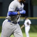 Los Angeles Dodgers' Matt Kemp rounds the bases on a two-run home run against the Houston Astros in the first inning of a baseball game Friday, April 20, 2012, in Houston. (AP Photo/Pat Sullivan)