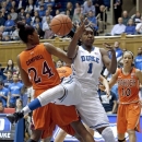 Duke's Elizabeth Williams (1) and Virginia Tech's Taijah Campbell (24) reach for a rebound during the first half of an NCAA college basketball game in Durham, N.C., Wednesday, Jan. 16, 2013. Duke won 58-26. (AP Photo/Gerry Broome)