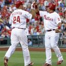 Philadelphia Phillies' Carlos Ruiz greets Ty Wiggington after he hit a two-run home run against the Pittsburgh Pirates in the third inning of a baseball game, Tuesday, June 26, 2012, in Philadelphia. (AP Photo/Michael Perez)