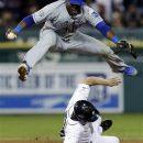 Detroit Tigers' Andy Dirks makes Kansas City Royals second baseman Irving Falu jump after tagging second base on a Detroit Tigers' Jhonny Peralta fielder's choice in the eighth inning of a baseball game in Detroit, Wednesday, Sept. 26, 2012. Peralta was safe at first base and pinch runner Don Kelly scored on the play. (AP Photo/Paul Sancya)