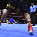 Errol Spence Jr., foreground, is directed by the referee to move after knocking down Phil Lo Greco, from Canada, during a welterweight fight on Saturday, June 20, 2015, in Las Vegas. Spence Jr. won in the third round. (AP Photo/David Becker)