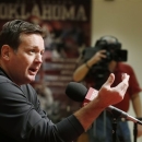 Oklahoma head coach Bob Stoops gestures as he answers a question during an NCAA college football news conference in Norman, Okla., Thursday, March 7, 2013. After a rare overhaul in his coaching staff this offseason, spring football practice begins this weekend. (AP Photo/Sue Ogrocki)