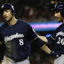 Milwaukee Brewers' Ryan Braun (8) is congratulated by Jonathan Lucroy (20) after scoring during the ninth inning of a baseball game against the Washington Nationals at Nationals Park in Washington, Friday, Sept. 21, 2012. The Brewers won 4-2. (AP Photo/Jacquelyn Martin)