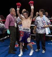 Japan's Toshiaki Nishioka celebrates after defeating Rafael Marquez, of Mexico, by unanimous decision in a WBC World super bantamweight title boxing fight, Saturday, Oct. 1, 2011, in Las Vegas.