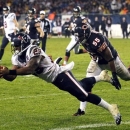 Houston Texans running back Arian Foster (23) makes a touchdown catch with Chicago Bears linebacker Lance Briggs (55) defending in the first half an NFL football game in Chicago, Sunday, Nov. 11, 2012. (AP Photo/Charles Rex Arbogast)
