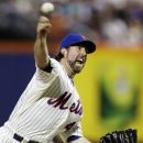 New York Mets starting pitcher R.A. Dickey (43) delivers in the first inning during an interleague baseball game against the New York Yankees at Citi Field in New York, Sunday, June 24, 2012. (AP Photo/Kathy Willens)