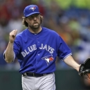 Toronto Blue Jays starting pitcher R.A. Dickey pumps his fist after retiring the Tampa Bay Rays during the ninth inning of a baseball game Wednesday, June 26, 2013, in St. Petersburg, Fla. Dickey pitched a complete game in the 3-0 win. (AP Photo/Chris O'Meara)