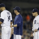 Detroit Tigers starting pitcher David Price, left, walks back to the dugout after being relieved by manager Brad Ausmus during the seventh inning of a baseball game against the Kansas City Royals, Friday, May 8, 2015, in Detroit. Looking on is third baseman Nick Castellanos, right, and Ian Kinsler. (AP Photo/Carlos Osorio)