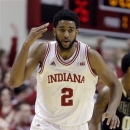 Indiana forward Christian Watford signals aftyer hitting a three-point basket against Purdue in the first half of a NCAA college basketball game in Bloomington, Ind., Saturday, Feb. 16, 2013. (AP Photo/Michael Conroy)