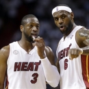 Miami Heat's LeBron James (6) talks with Dwyane Wade (3) during the first half of Game 5 of an NBA basketball Eastern Conference semifinal against the Chicago Bulls, Wednesday, May 15, 2013, in Miami. (AP Photo/Wilfredo Lee)