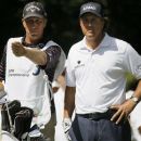 Phil Mickelson, right, listens to Jim Macky during the third round of the BMW Championship PGA golf tournament at Crooked Stick Golf Club in Carmel, Ind., Saturday, Sept. 8, 2012. (AP Photo/Charles Rex Arbogast)