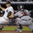 Atlanta Braves catcher Brian McCann (16) tags out New York Yankees' Mark Teixeira during the fifth inning of a baseball game at Yankee Stadium in New York, Tuesday, June 19, 2012. (AP Photo/Kathy Willens)