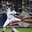 New York Yankees shortstop Derek Jeter, top, jumps to avoid Boston Red Sox runner Mike Napoli who was out on a fielder's choice during the fifth inning of a baseball game on Thursday, Sept. 5, 2013, at Yankee Stadium in New York. (AP Photo/Bill Kostroun)