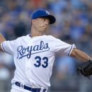 Kansas City Royals starter Jeremy Guthrie pitches to an Oakland Athletics batter during the first inning of a baseball game at Kauffman Stadium in Kansas City, Mo., Tuesday, Aug. 14, 2012. (AP Photo/Orlin Wagner)