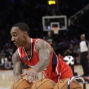 Jeff Teague of the Atlanta Hawks grabs a ball during the skills challenge in NBA basketball All-Star Saturday Night, Feb. 16, 2013, in Houston. (AP Photo/Eric Gay)