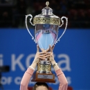 Andrea Petkovic of Germany holds up her trophy after defeating Flavia Pennetta of Italy in the final of the Garanti Koza WTA tennis tournament in Sofia, Sunday, Nov. 2 , 2014. (AP Photo)