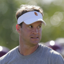Southern California head coach Lane Kiffin watches during NCAA college football practice on Tuesday, Aug. 6, 2013, in Los Angeles. (AP Photo/Jae C. Hong)