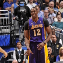 ORLANDO, FL - MARCH 12: Dwight Howard #12 of the Los Angeles Lakers smiles while dribbling the ball against the Orlando Magic during the game on March 12, 2013 at Amway Center in Orlando, Florida. (Photo by Fernando Medina/NBAE via Getty Images)