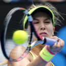 Eugenie Bouchard of Canada makes a forehand return to Irina-Camelia Begu of Romania during their fourth round match at the Australian Open tennis championship in Melbourne, Australia, Sunday, Jan. 25, 2015. (AP Photo/Vincent Thian)