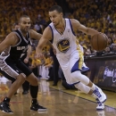 Golden State Warriors shooting guard Stephen Curry (30) drives against San Antonio Spurs point guard Tony Parker (9) during the first quarter of Game 4 of a Western Conference semifinal NBA basketball playoff series in Oakland, Calif., Sunday, May 12, 2013. (AP Photo/Marcio Jose Sanchez)