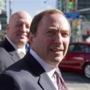 NHL commissioner Gary Bettman, foreground, arrives with deputy commissioner Bill Daly as the NHL and its locked-out player resume negotiations in Toronto on Wednesday Oct. 16, 2012. (AP Photo/The Canadian Press, Chris Young)