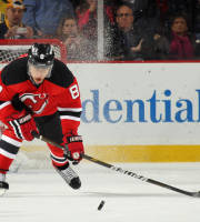 NEWARK, NJ - DECEMBER 28: Dainius Zubrus #8 of the New Jersey Devils pushes the puck out of his own zone during the game against the Buffalo Sabres at the Prudential Center on December 28, 2011 in Newark, New Jersey. The Devils defeated the Sabres 3-1. (Photo by Bruce Bennett/Getty Images)