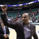Harvard head coachTommy Amaker celebrates after his team defeated New Mexico New Mexico 68-62 during a second-round game in the NCAA college basketball tournament in Salt Lake City Thursday, March 21, 2013. (AP Photo/Rick Bowmer)