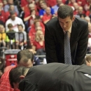 Butler head coach Brad Stevens looks on as his trainers attend to Rotnei Clarke after Clarke was injured during the first half of an NCAA college basketball game against Dayton, Saturday, Jan. 12, 2013, in Dayton, Ohio. Clarke was taken from the arena on a backboard.(AP Photo/Skip Peterson)