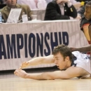 Metro State center Nicholas Kay passes from the floor as Drury guard Brandon Lockhart (21) defends during the first half of the NCAA Division ll national championship basketball game Sunday April 7, 2013, in Atlanta. (AP Photo/John Amis)