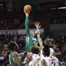 Baylor forward Brittney Griner, back, shoots over Oklahoma forward Joana McFarland and Aaryn Ellenberg during the first half of a NCAA Women's basketball game in Norman, Monday, Feb. 25, 2013. (AP Photo/Alonzo Adams)