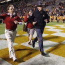 Alabama head coach Nick Saban, front left, waves as he leave the field after an NCAA college football game against Tennessee, Saturday, Oct. 20, 2012, in Knoxville, Tenn. Alabama won 44-13. (AP Photo/Wade Payne)