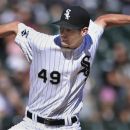 Chicago White Sox starter Chris Sale delivers a pitch in the first inning during a baseball game against the Kansas City Royals in Chicago, Saturday, Sept. 8, 2012. (AP Photo/Paul Beaty)