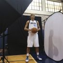 **CORRECTS DAY TO FRIDAY** Dallas Mavericks Dirk Nowitzki of Germany posses for a photo during team's  media day Friday Sept. 28, 2012, in Dallas. Nowitzki again has a lot of new teammates with the Mavericks. For the second year in a row, this time after being swept out of the playoffs instead of winning the NBA title, the Mavs have drastically altered their roster. (AP Photo/LM Otero)