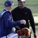 Tiger Woods talks to his caddie Joe LaCava on the ninth hole during a practice round for the U.S. Open Championship golf tournament Monday, June 11, 2012, in San Francisco. (AP Photo/Morry Gash)