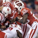 Wisconsin running back Montee Ball (28) is tackled by Nebraska safety P.J. Smith (13) during the first half of the Big Ten championship NCAA college football game Saturday, Dec. 1, 2012, in Indianapolis. (AP Photo/Michael Conroy)