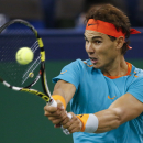 Rafael Nadal of Spain returns a shot to Feliciano Lopez of Spain during their men's singles second round match at the Shanghai Masters Tennis Tournament in Shanghai, China, Wednesday, Oct. 8, 2014. (AP Photo/Vincent Thian)