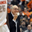 Syracuse head coach Jim Boeheim smiles late in the second half against Rutgers during an NCAA college basketball game in Syracuse, N.Y., Wednesday, Jan. 2, 2013. Syracuse won 78-53 for Boeheim's 903rd career victory passing Bobby Knight. (AP Photo/Kevin Rivoli)
