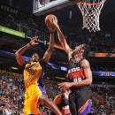 PHOENIX, AZ - MARCH 18: Hamed Haddadi #98 of the Phoenix Suns blocks a shot against Dwight Howard #12 of the Los Angeles Lakers on March 18, 2013 at U.S. Airways Center in Phoenix, Arizona. (Photo by Barry Gossage/NBAE via Getty Images)