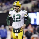 Green Bay Packers quarterback Aaron Rodgers (12) reacts during the first half of an NFL football game against the New York Giants, Sunday, Nov. 25, 2012, in East Rutherford, N.J. (AP Photo/Kathy Willens)