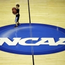 Mason Williams, 7, son of  Marquette head coach Buzz Williams,  helps collect basketballs during practice for a regional semifinal game in the NCAA college basketball tournament, Wednesday, March 27, 2013, in Washington. Marquette plays Miami on Thursday. (AP Photo/Pablo Martinez Monsivais)