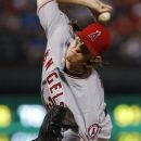 Los Angeles Angels starting pitcher Jered Weaver delivers to the Texas Rangers in the first inning of a baseball game Friday, Sept. 28, 2012, in Arlington, Texas. (AP Photo/Tony Gutierrez)